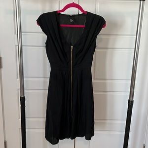 Black H&M dress with gold zipper detail. Size 4